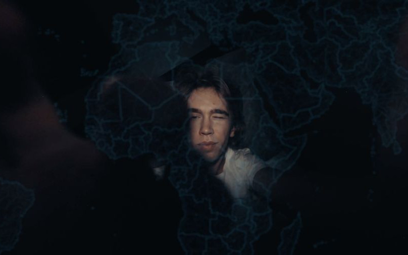 Alek with the map at night, at home in Poland